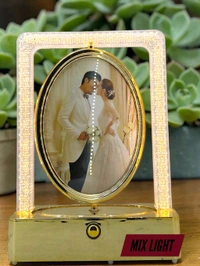 rotating photo frame lamp often branded as a Crystal Rotating LED Photo Lamp.