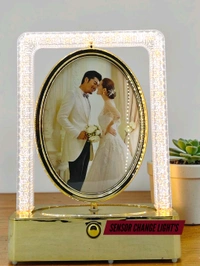 rotating photo frame lamp often branded as a Crystal Rotating LED Photo Lamp.