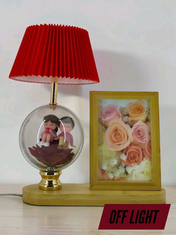 a personalized photo frame and couple figurine night lamp decorative table lamp.