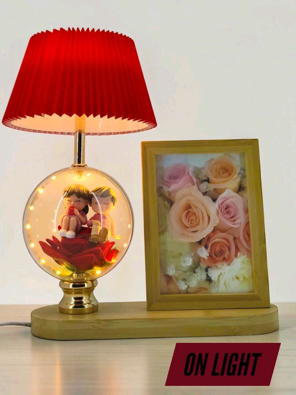 a personalized photo frame and couple figurine night lamp decorative table lamp.