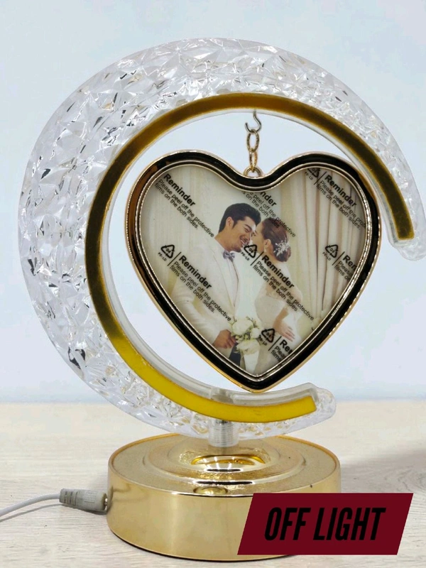 personalized crystal LED crescent moon lamp with a rotating heart-shaped photo frame.