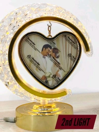 personalized crystal LED crescent moon lamp with a rotating heart-shaped photo frame.