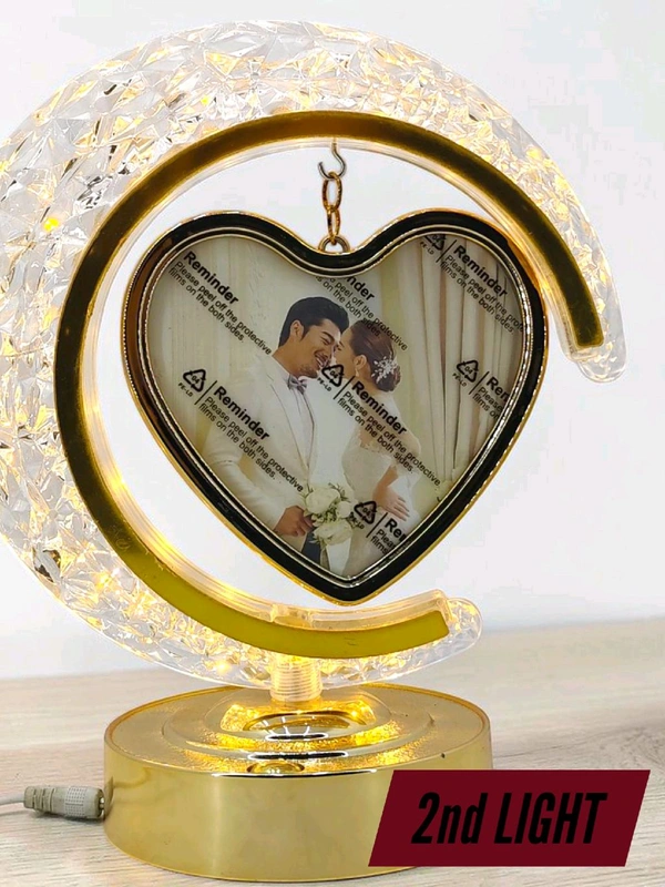 personalized crystal LED crescent moon lamp with a rotating heart-shaped photo frame.