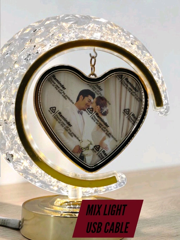 personalized crystal LED crescent moon lamp with a rotating heart-shaped photo frame.