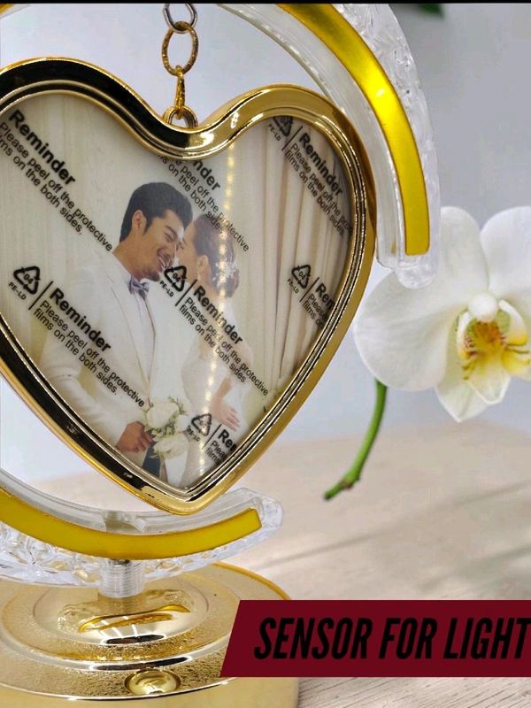 personalized crystal LED crescent moon lamp with a rotating heart-shaped photo frame.