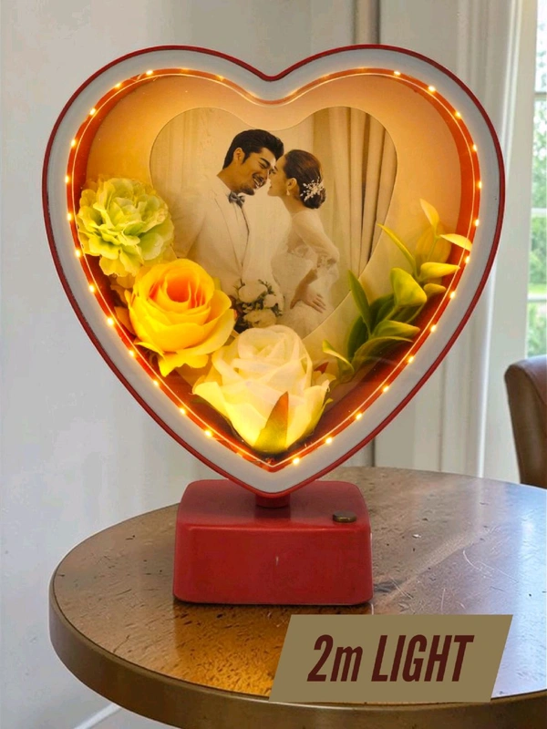 heart-shaped LED photo frame, often referred to as a "magic mirror" frame, designed for personalized gifting and home decor with built-in flowers and lighting.