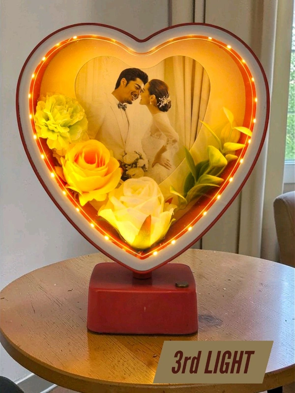 heart-shaped LED photo frame, often referred to as a "magic mirror" frame, designed for personalized gifting and home decor with built-in flowers and lighting.