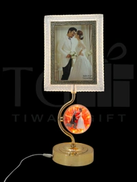 a decorative LED photo frame and lamp featuring a romantic wedding theme, likely from a brand specializing in home decor gifts.