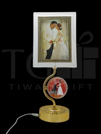 a decorative LED photo frame and lamp featuring a romantic wedding theme, likely from a brand specializing in home decor gifts.