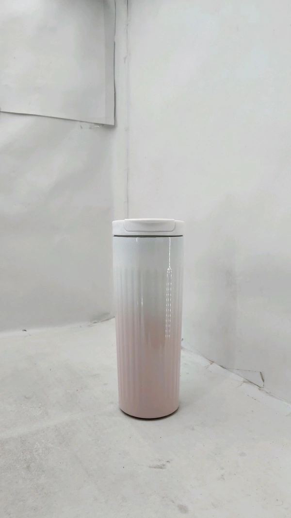 a stainless steel insulated travel mug, similar in design to brands like Chilly's or Nestasia.