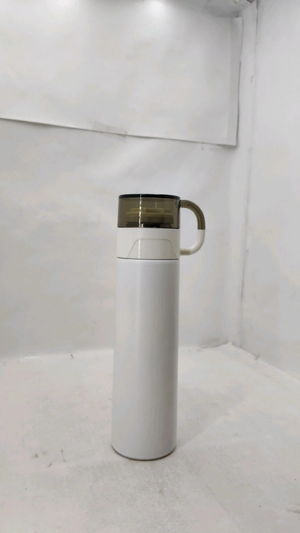a white stainless steel vacuum insulated water bottle with a handle lid.