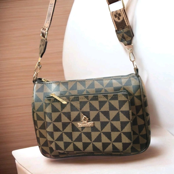 This Storite women's crossbody sling bag features a coffee-colored geometric monogram pattern and a gold-toned logo plaque.