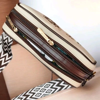 This is a Coach Women's Jes Crossbody bag featuring the iconic Horse and Carriage.