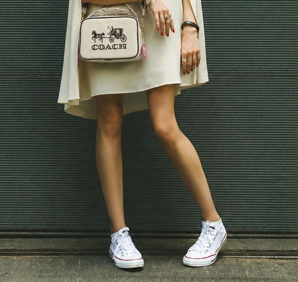 This is a Coach Women's Jes Crossbody bag featuring the iconic Horse and Carriage.
