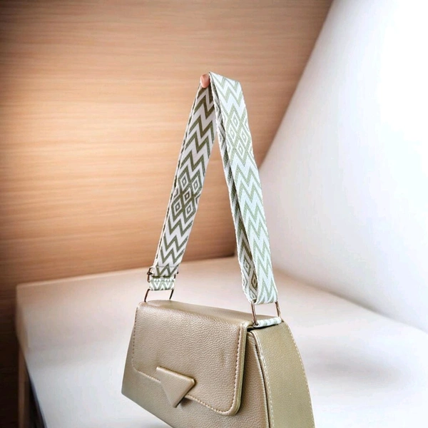 Aldo Softpuff shoulder bag features a structured silhouette in bordo faux leather and a distinctive patterned strap.
