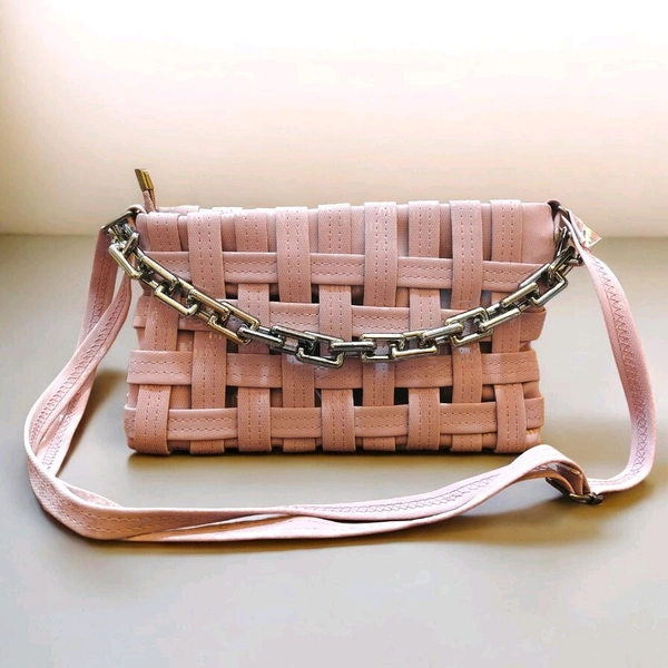 This pink generic Shilpikraft shoulder sling bag features a unique woven pattern and a prominent silver chain strap.