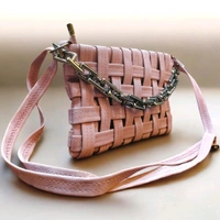This pink generic Shilpikraft shoulder sling bag features a unique woven pattern and a prominent silver chain strap.