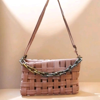This pink generic Shilpikraft shoulder sling bag features a unique woven pattern and a prominent silver chain strap.