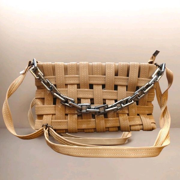 This Brown generic Shilpikraft shoulder sling bag features a unique woven pattern and a prominent silver chain strap.