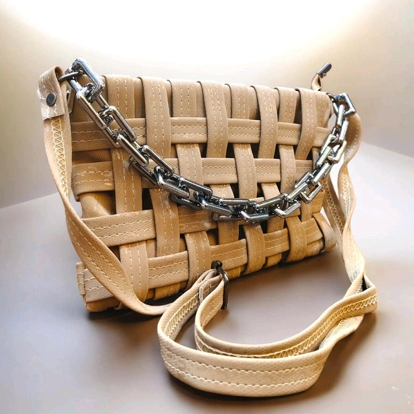 This Brown generic Shilpikraft shoulder sling bag features a unique woven pattern and a prominent silver chain strap.