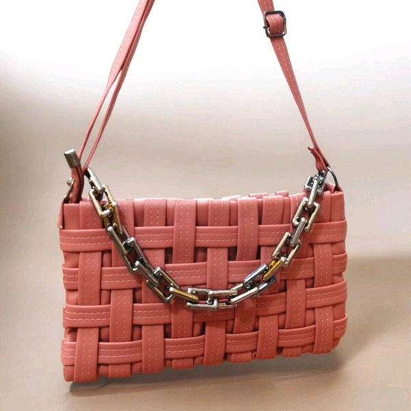 This Pink generic Shilpikraft shoulder sling bag features a unique woven pattern and a prominent silver chain strap.