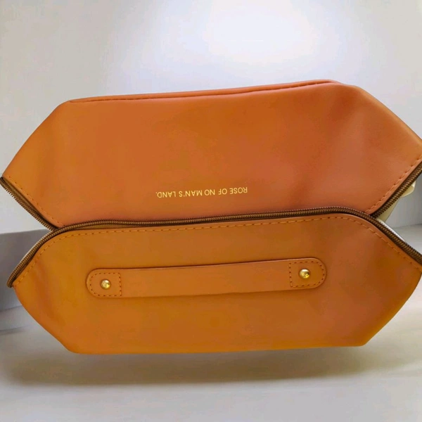This brown PU leather cosmetic bag is branded with "ROSE OF NO MAN'S LAND.