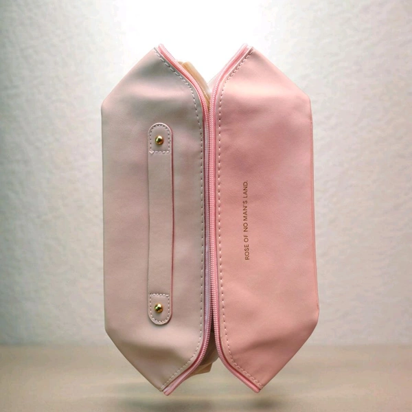 This Pink. PU leather cosmetic bag is branded with "ROSE OF NO MAN'S LAND.