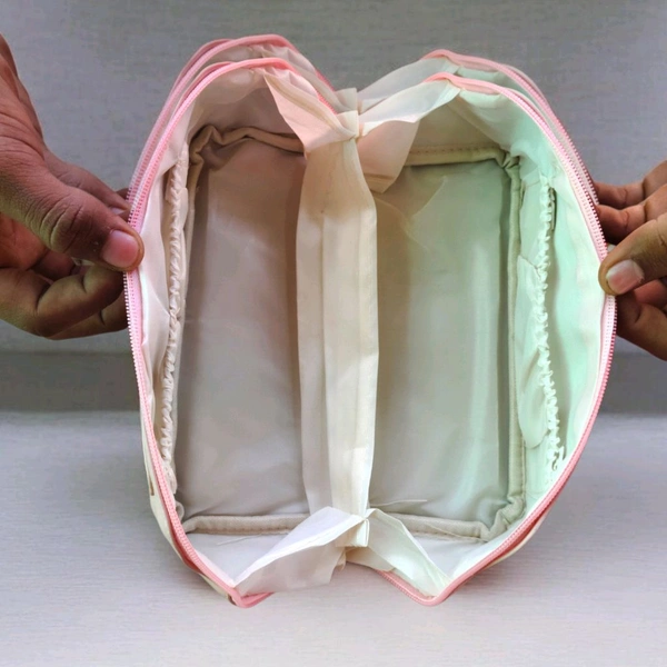 This Pink. PU leather cosmetic bag is branded with "ROSE OF NO MAN'S LAND.