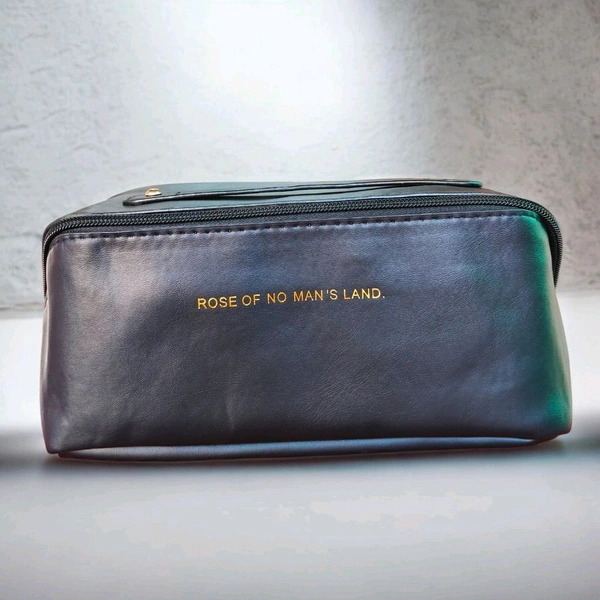 This Black PU leather cosmetic bag is branded with "ROSE OF NO MAN'S LAND