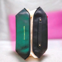 This Black PU leather cosmetic bag is branded with "ROSE OF NO MAN'S LAND