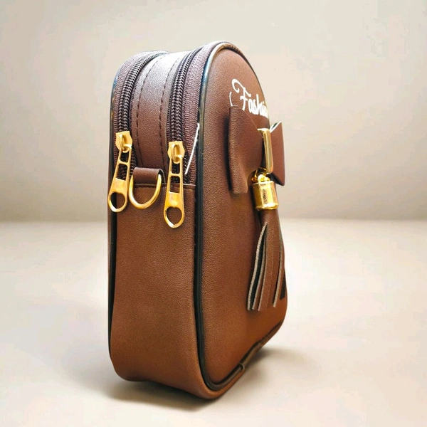 This ZB Luxury brown faux leather satchel features a distinctive front bow detail and "Fashsion" branding