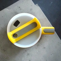 This yellow Enem tumbler features a matching lid, built-in straw, and a side handle for easy carrying.