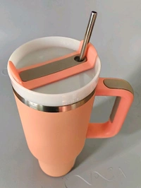 This tumbler features a sturdy handle, stainless steel straw, and a capacity of 1200 ml.2084