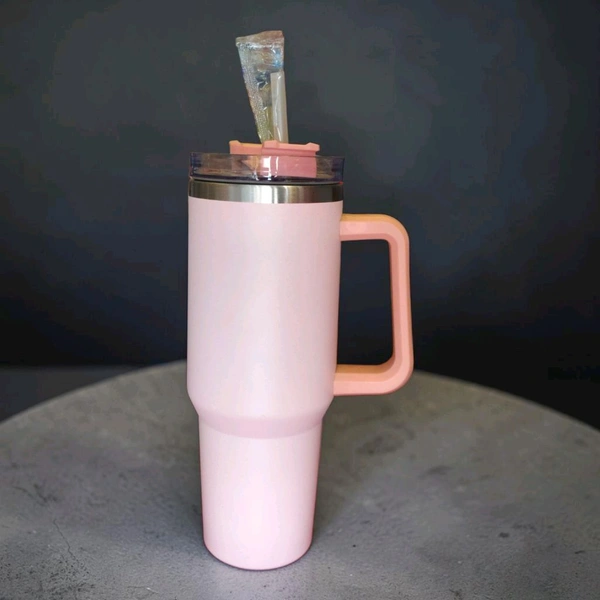 This 40-ounce stainless steel tumbler features a light Pink color and a sturdy handle.2086