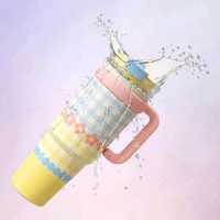 This is a Glacora insulated tumbler featuring a charming pink and blue gingham pattern with floral and dot accents.