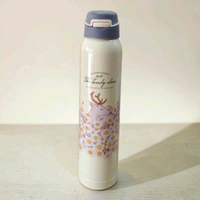 This stainless steel vacuum insulated water bottle features a "Lovely Elves" printed design with a deer and flowers.